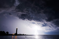 Lighthouse under dark sky - Photo by Darko Pribeg on Unsplash