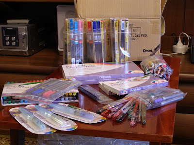 Pentel brush pens, markers, pastels, gel rollers and other drawing tools