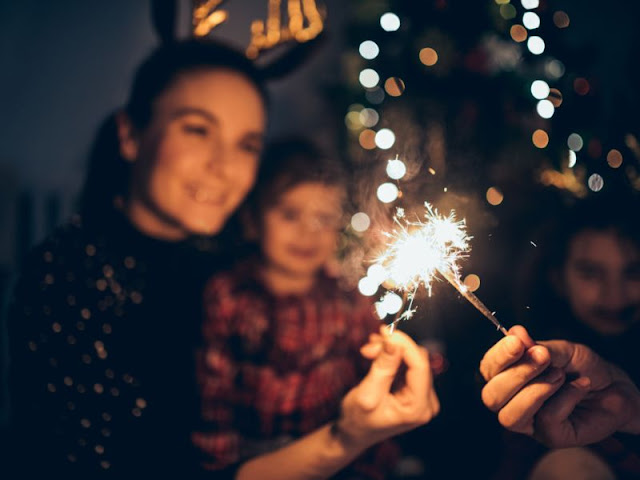 A family with a sparkler