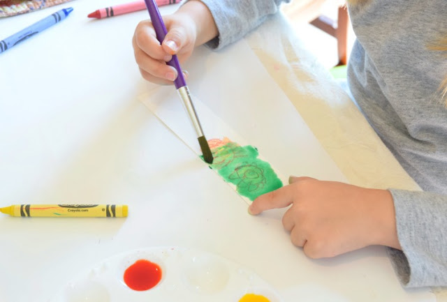 Simple kid-made gift for Father's Day- watercolor resist bookmarks. What can you get the Dad who likes to read more than he likes sports, gadgets, or cars? Bookmarks covered with kid-made art.