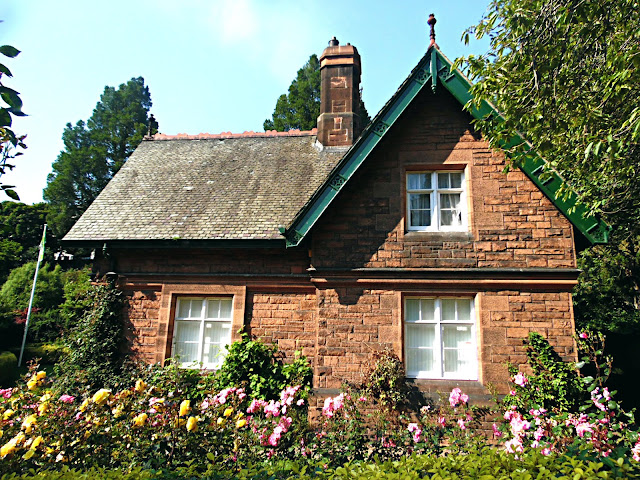 groundskeepers cottage with flowers in  summer