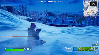 Rally Raider slides down a snowy hill in Fortnite.