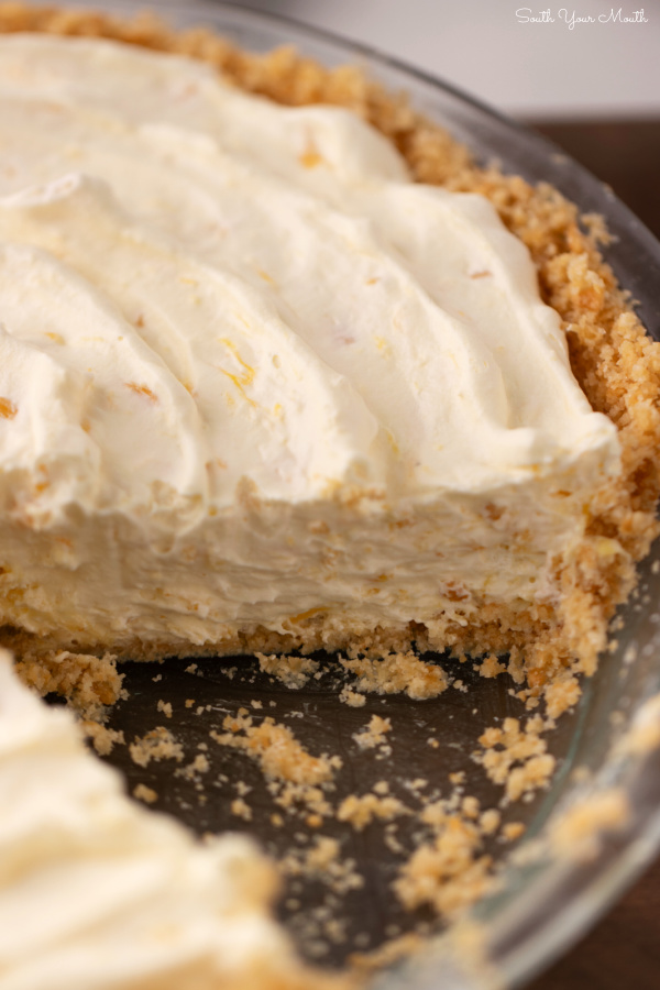 Pig Pickin’ Pie! A cool and creamy no-bake pineapple pie made like the frosting of a classic Pig Pickin' Cake (aka Pea Picking Cake) with a unique butter-crunch crust perfect for the sweet, whipped filling.