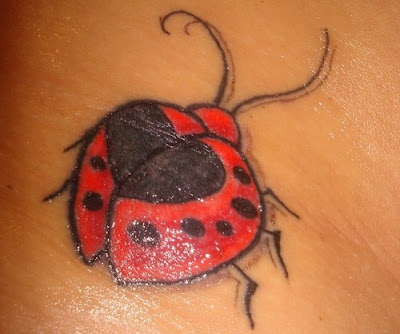 Close up photo of ladybug tattoo.