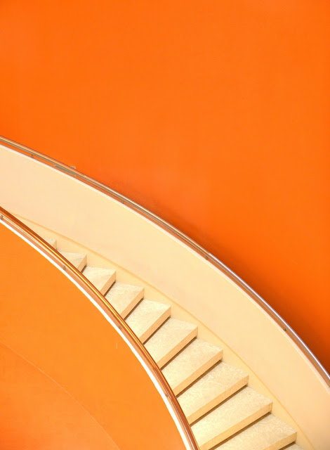stairs against orange wall:Photo by Ambrose Chua on Unsplash