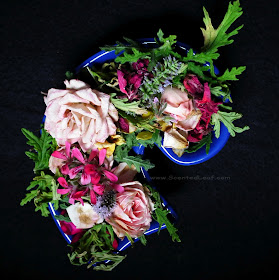 Potpourri with rosebuds and scented pelargonium leaves and flowers