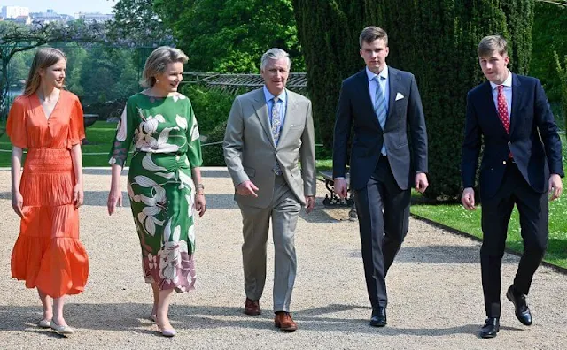 Princess Eleonore wore a new orange satiny dress by Maje. Carolina Herrera earrings. Princess Astrid wore a skirt by Essentiel Antwerp