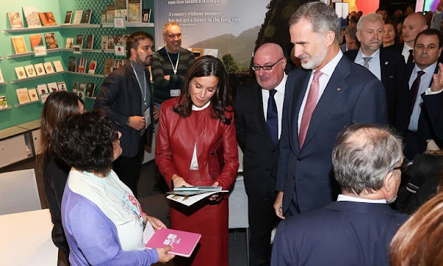 Queen Letizia wore a white Iyabo silk top by Hugo Boss, and red Selrita leather jacket and pencil skirt by Hugo Boss