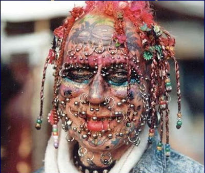 tattoos and piercings as long as they don't disfigure themselves like this: