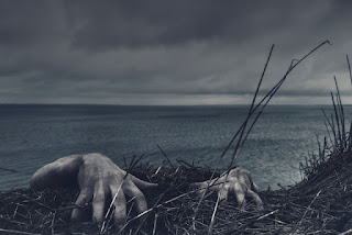 Hands of a zombie hanging on the side of a cliff photo by Daniel Jensen via Unsplash - https://unsplash.com/photos/NMk1Vggt2hg