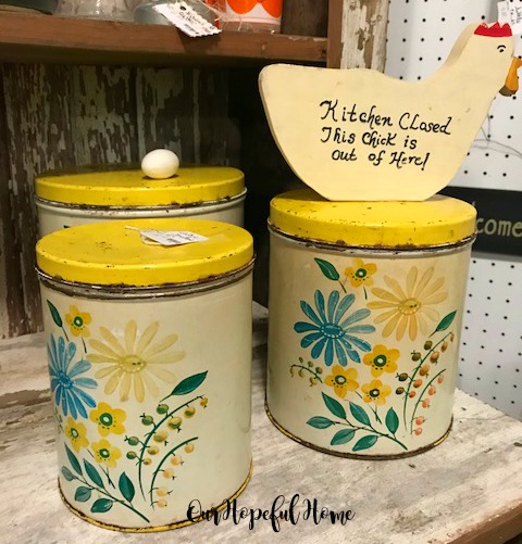 vintage yellow kitchen tins lids flowers