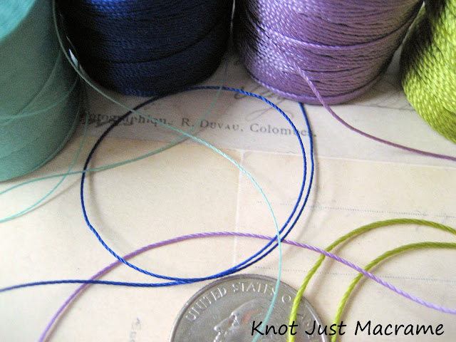 Close up of different sizes or weights of bead cord for micro macrame