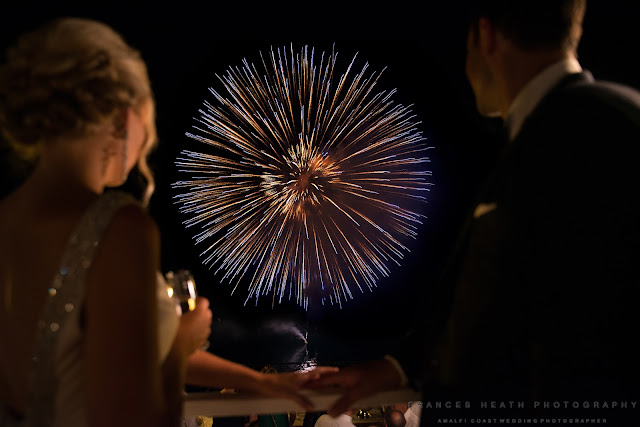 Bride and groom watching fireworks