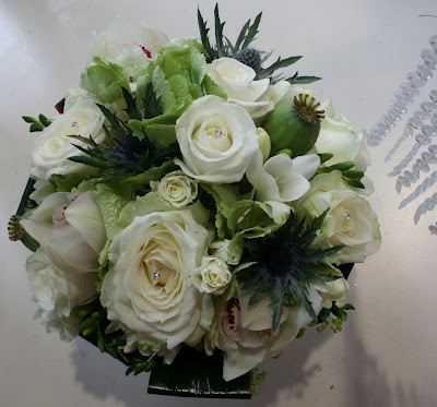 Trial wedding bouquet in White Avalanche Roses Blue Eryngium Ivory pink 