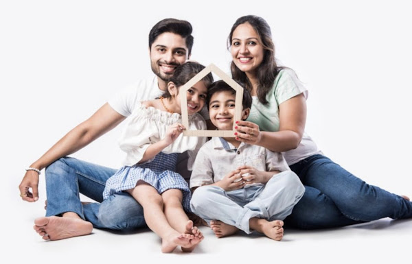 Indian family of 4 holding trapezoid wood in front of faces
