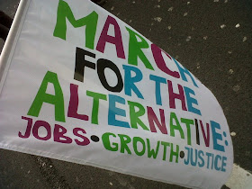 Emsy's 'March for the Alternative: Jobs, Growth, Justice' flag