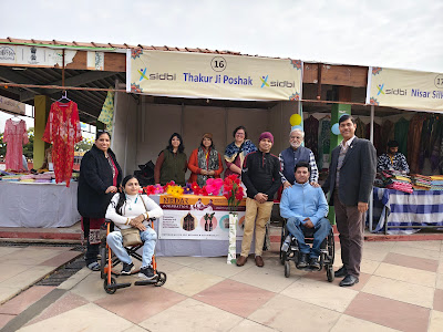 Mr. Vashishth with panel Speakers Mr. Rajendran (NEDAR) and Ms. Kishwar posing at the NEDAR stall at the NOIDA Utsav