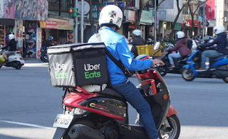 UberEats' employee making deliveries