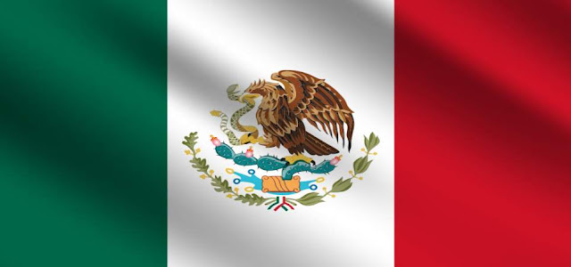 Which animal is biting a snake in the middle of the Mexican flag?