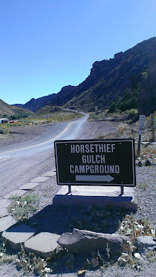 Horsethief Campground Sign with entrance road view