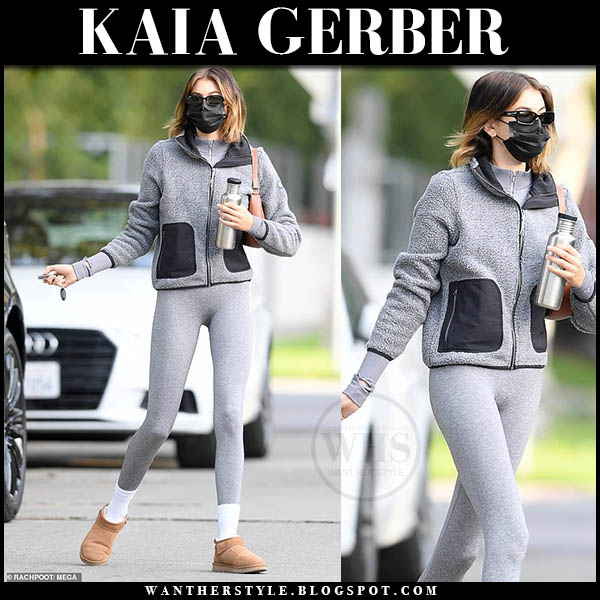 Kaia Gerber in grey fleece jacket, grey leggings and brown boots