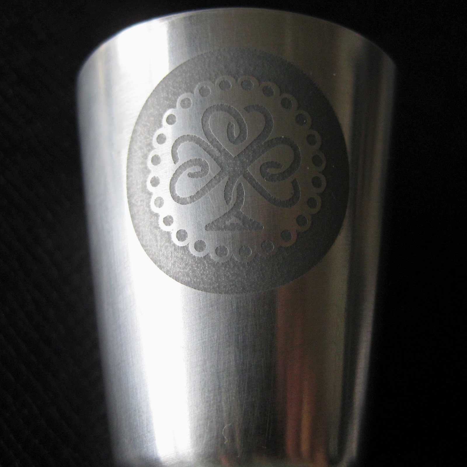 Stainless Steel Shot Glasses Close Up.  Etched with Edinburgh Etch Solution (Ferric Chloride) using Vinyl Resists Cut with Silhouette Cameo.  Tutorial by Nadine Muir for Silhouette UK Blog