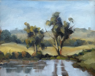 Landscape oil painting of two eucalypts beside a dam.