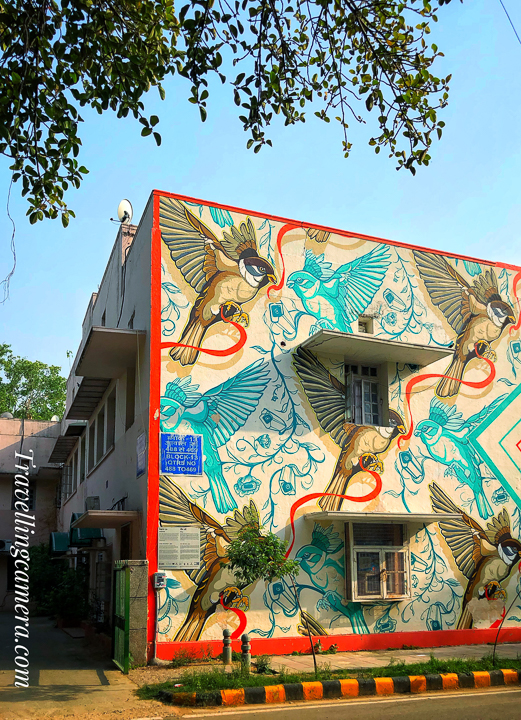 Above photograph shows "Cause and Effect" by Sam Lo. A Singaporean artist, Sam Lo’s (SKL0) artwork in Lodhi Colony reflects on the idea of freedom and interrelationship using ribbons and sparrows.