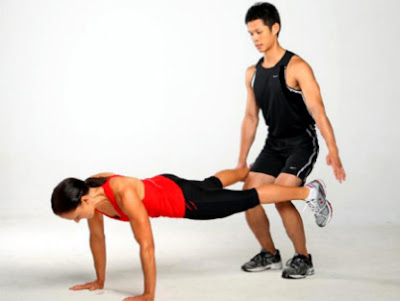 man and woman push ups