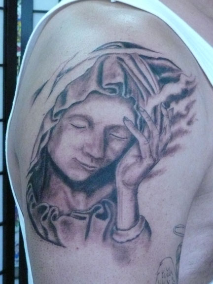 Angel themed sleeve tattoo