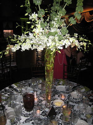 Beautiful Tall Centerpieces with white Orchids and bells of Ireland