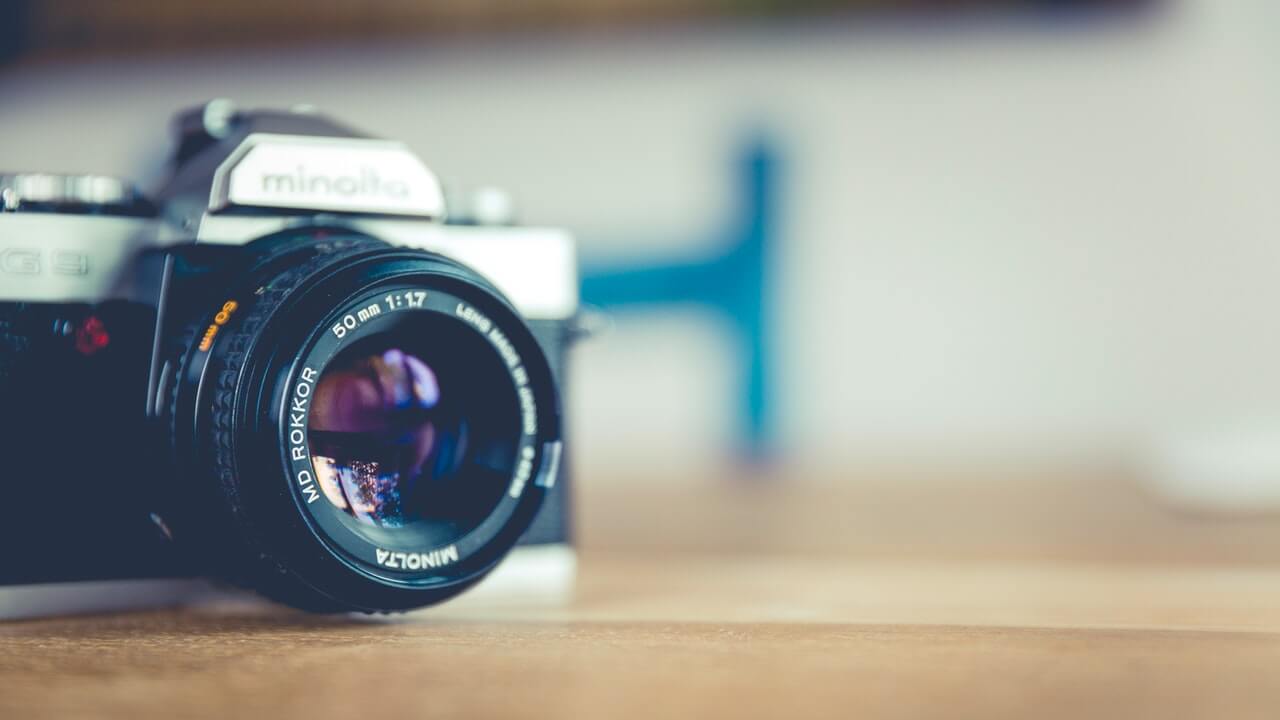 silver camera on top of table | 10 Product Photography Tips