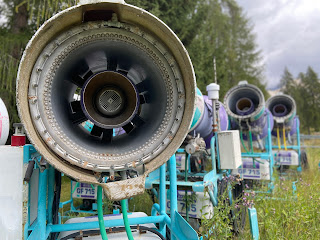 Idle snow equipment on the slopes below Rifugio Mietres.