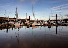 Photo of reflections in the calm water at Maryport Marina on Wednesday