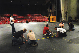 Stage managers marking-up a stage