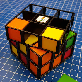 Rubik's Cage with several blocks inserted and several spaces, shows gameplay in progress