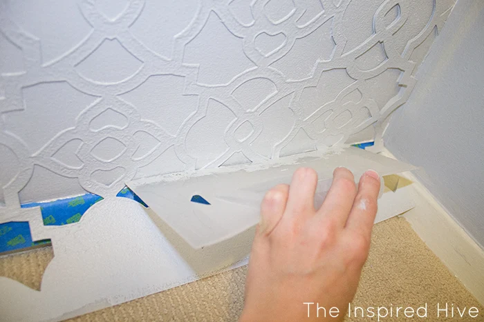 Part one of a beautiful walk in closet makeover! How to stencil a feature wall using Royal Design Studio stencils.