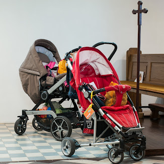 When can the baby sit in the stroller without car seat