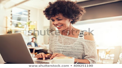 A female marketer working on a computer.