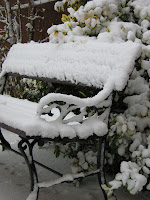 Garden bench in the snow