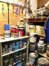 Organize your paint and related painting supplies with shelves and plumbing pipe.