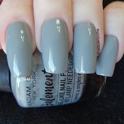 A swatch photo showing two coats of Madam Glam "Souvenirs," a light grey creme polish