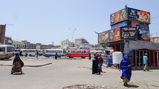 Fully covered women in the streets trading Khat