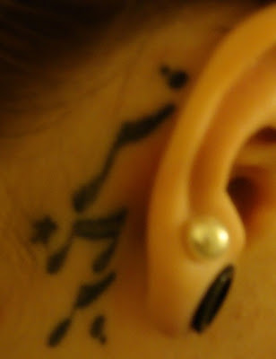 Right Ear Music Notes Tattoo