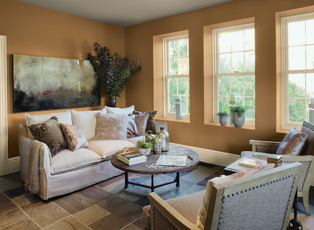 attractive living room paint color ideas with brown accent wall and three white bay windows