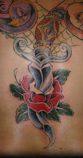 Tattoo of a Rose and Dagger - Spider Web Tattoo