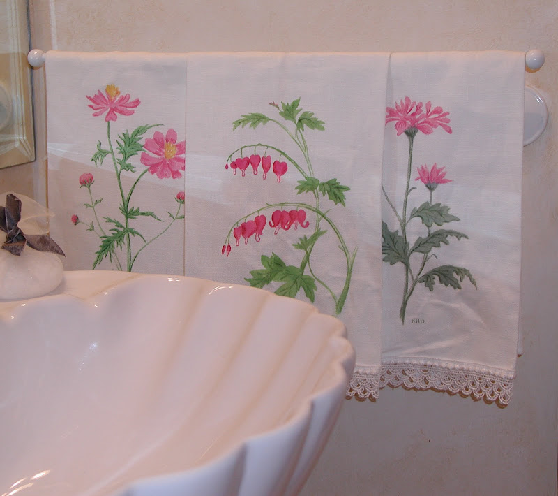 Hand painted hand towels and wastebasket. title=