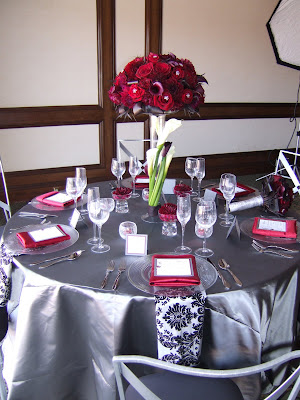Elegant silver and red was the choice for this lovely table setting by What