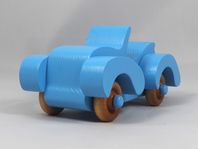 Handmade Wooden Toy Car Finished With Baby Blue Acrylic Paint and Amber Shellac. A Fat-Fendered Freaky Ford Roadster Convertible