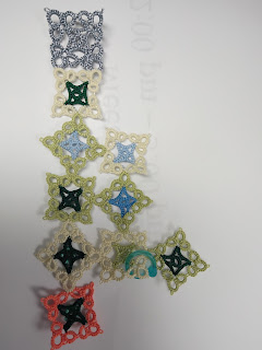 10 square tatted motifs, alternating square set and on point. 1st motif is metallic silvery blue. Other motifs have 2 colors, inner for low temp of the day and outer for high temp of the day. 2 motifs have beads added.